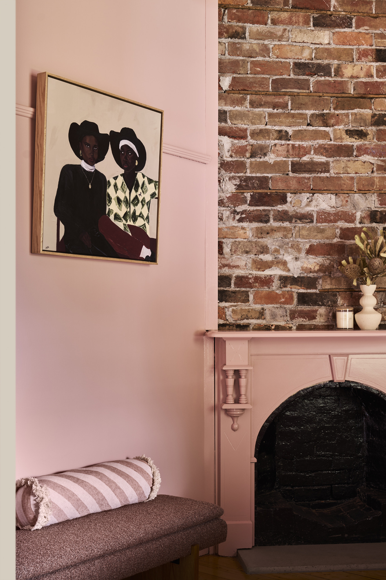 The Pink Room — original brick fireplace and pink walls